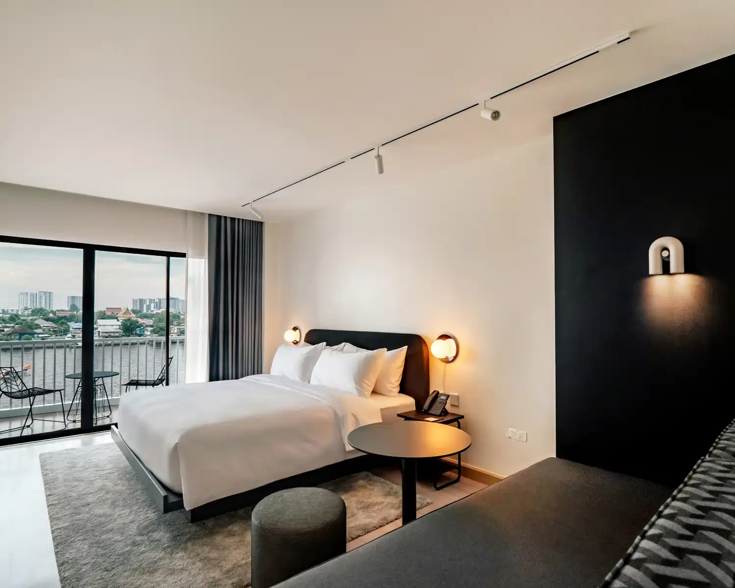 Premium King Riverview — temporary StandardX room photograph